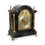 An ebonised mantel clock, 19th century,