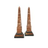 A pair of large marble obelisks,