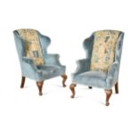 A pair of George II style wing arm chairs, late 19th century,