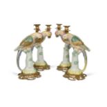 A set of four gilt metal mounted porcelain parrot candlesticks, modern,
