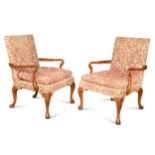 A pair of George I style mahogany open arm chairs,