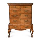 A George I walnut chest on stand,