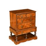 A miniature walnut William & Mary style chest on stand, 20th century,