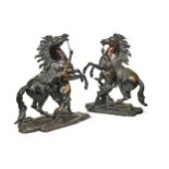 After Guillaume Coustou (1677-1746), a large pair of French bronze 'Marly Horses', circa 1880,