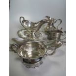 A collection of silver plated ware including a kettle and stand, soup tureen, sauce boat and