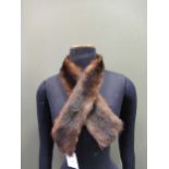 A quantity of fur stoles, scarves, two Russian ushanka bear skin hats and fur berets