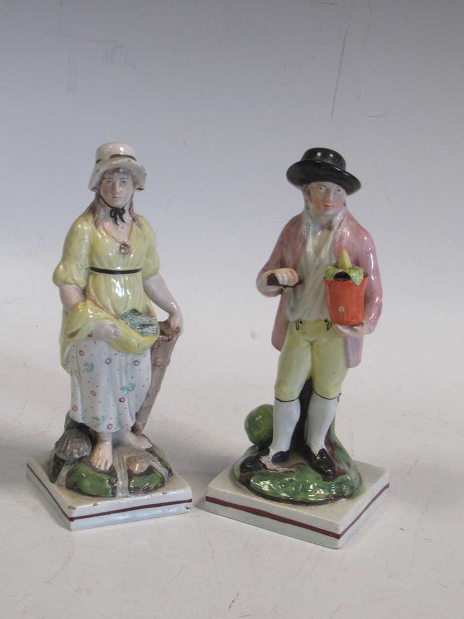 Two Staffordshire pearlware figures of a gardener and a fisherwoman, tallest 17cm highCondition