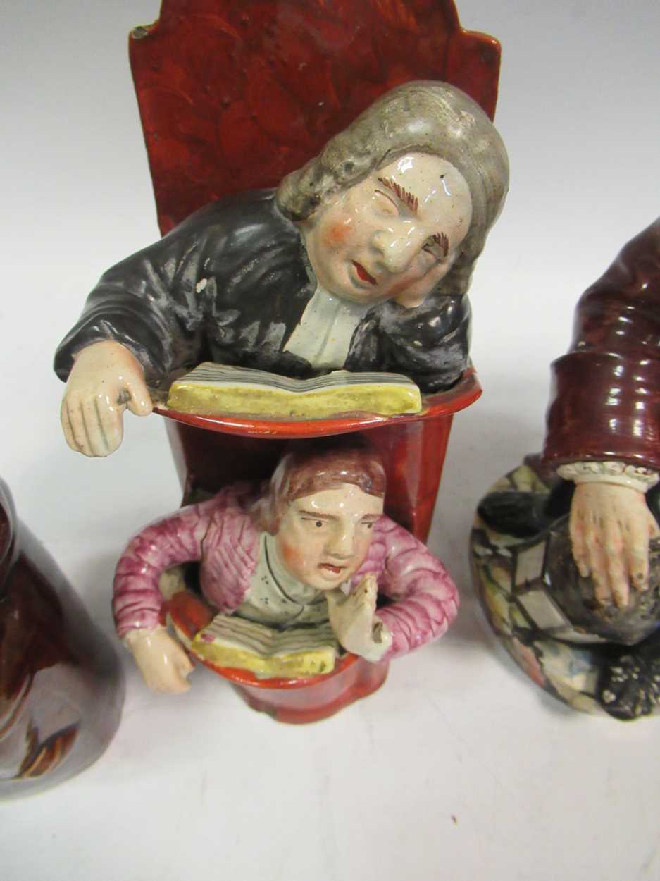 Two treacle glazed spirit flasks modelled as 'Old Tom'; a Staffordshire figure of 'The judge and the - Bild 5 aus 7