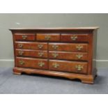 A reproduction Georgian style chest of drawers, comprising of seven drawers on bracket feet 79 x 139