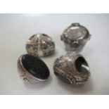 Four 19th century Arabic silver rings