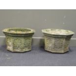 A pair of composite stone octagonal planters 30cm high, 49cm wide (2)