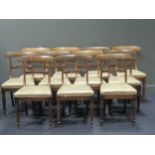 A set of eleven Regency rosewood bar back dining chairs