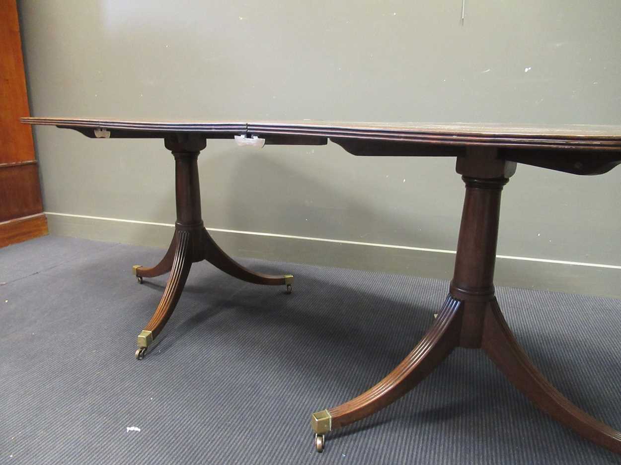 A George III style mahogany twin pedestal dining table with one leaf, early 20th century, the - Image 2 of 8