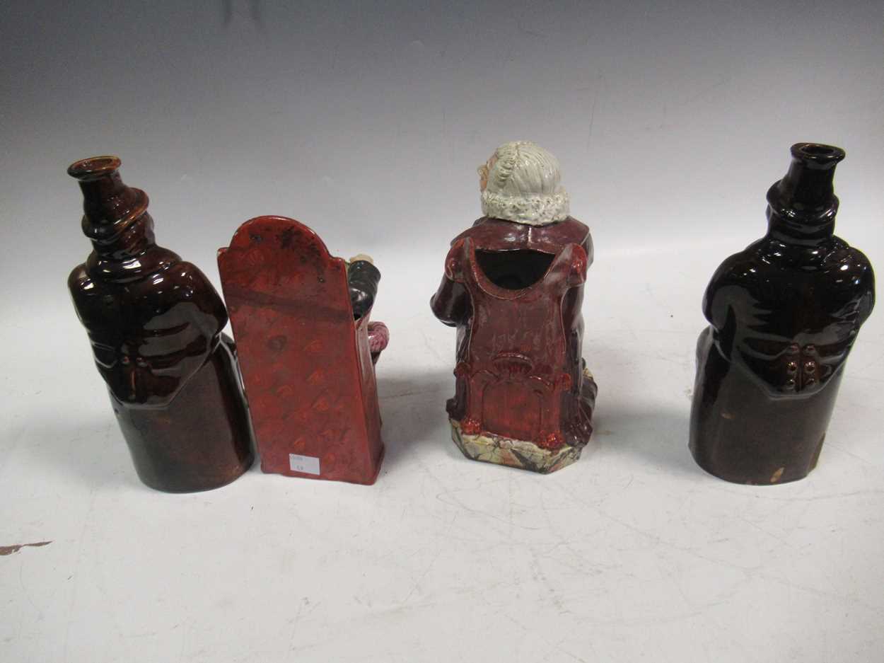 Two treacle glazed spirit flasks modelled as 'Old Tom'; a Staffordshire figure of 'The judge and the - Bild 3 aus 7