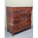 A large 19th century mahogany chest of two short over thre long graduating drawers with a shaped