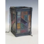 A hanging lantern with stained glass panels 18 x 17 x 17cm