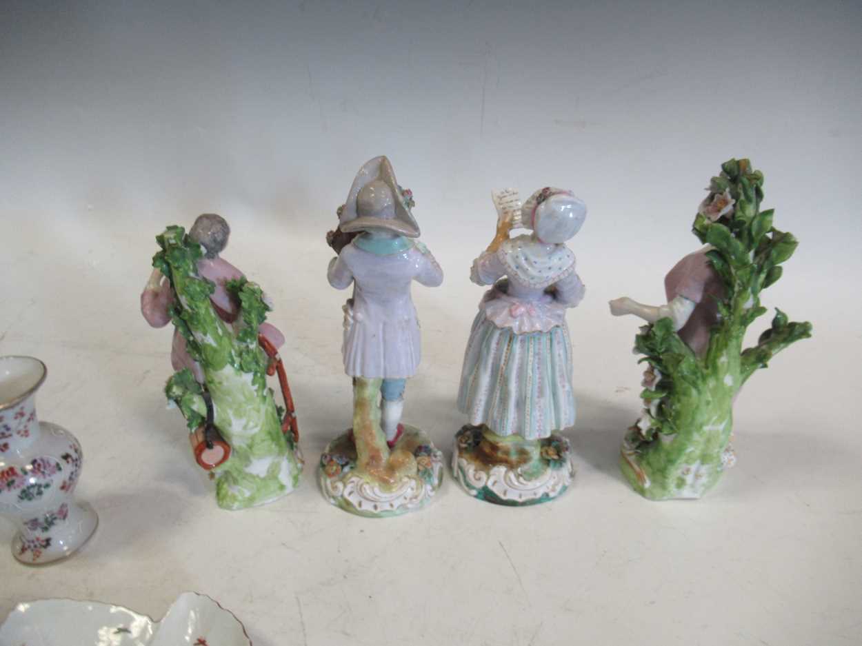 A pair of continental porcelain figurines, two Chelsea style figurines, a pair of Sampson - Image 6 of 8