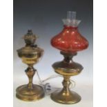 Two oil lamps (one adapted to electricity)