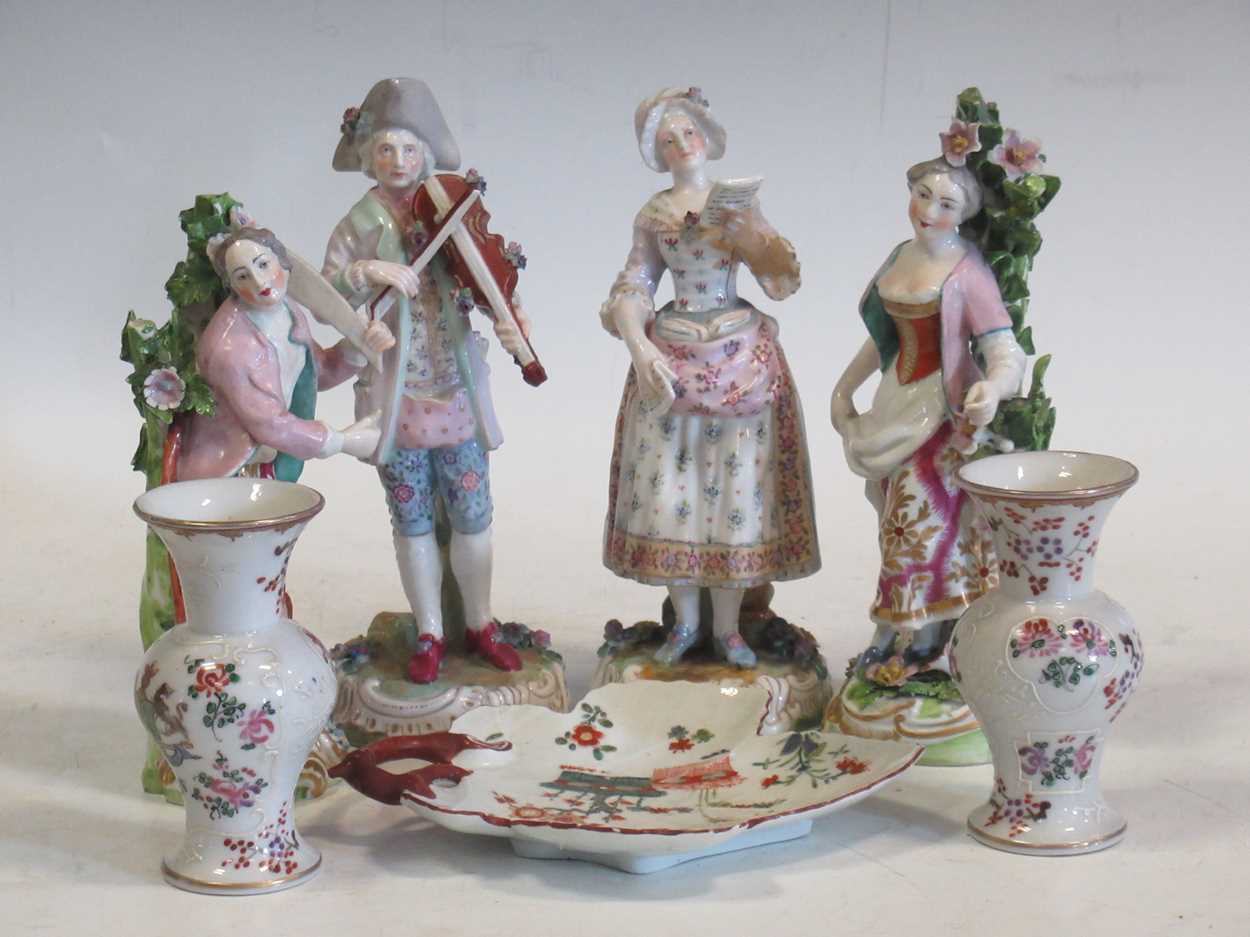 A pair of continental porcelain figurines, two Chelsea style figurines, a pair of Sampson