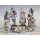 A pair of continental porcelain figurines, two Chelsea style figurines, a pair of Sampson