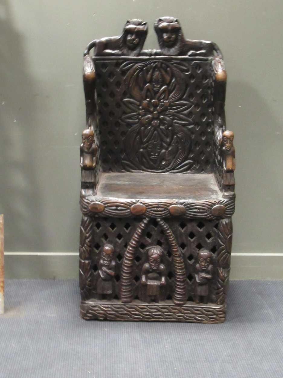 A Bamileke throne chair, profusely carved with animals, patterns and figures 140 x 70 x 55cm - Image 2 of 7