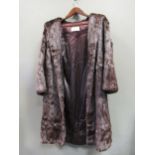 A mink three quarter length fur coat and another white knee length fur coat both size 12/14
