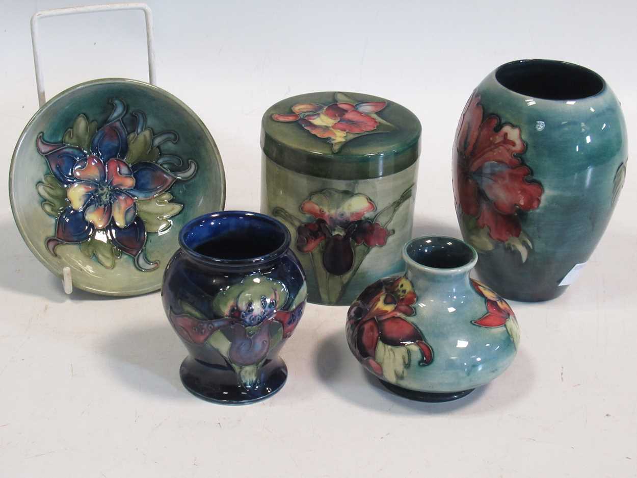 A small collection of mid-century Moorcroft, comprising an Orchid pattern jar and cover, an Orchid