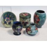A small collection of mid-century Moorcroft, comprising an Orchid pattern jar and cover, an Orchid