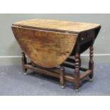 A 19th century oak gateleg table with single end drawer on turned legs 74 x 108 x 141cm open and