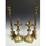 Two pairs of brass candelsticks and a copper milk churn