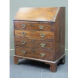 An oak fall front bureau with four graduated drawers 99 x 76 x 46cm