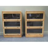 A pair of oak Globe Wernike style bookcases each with three compartments 129 x 88 x 34cm