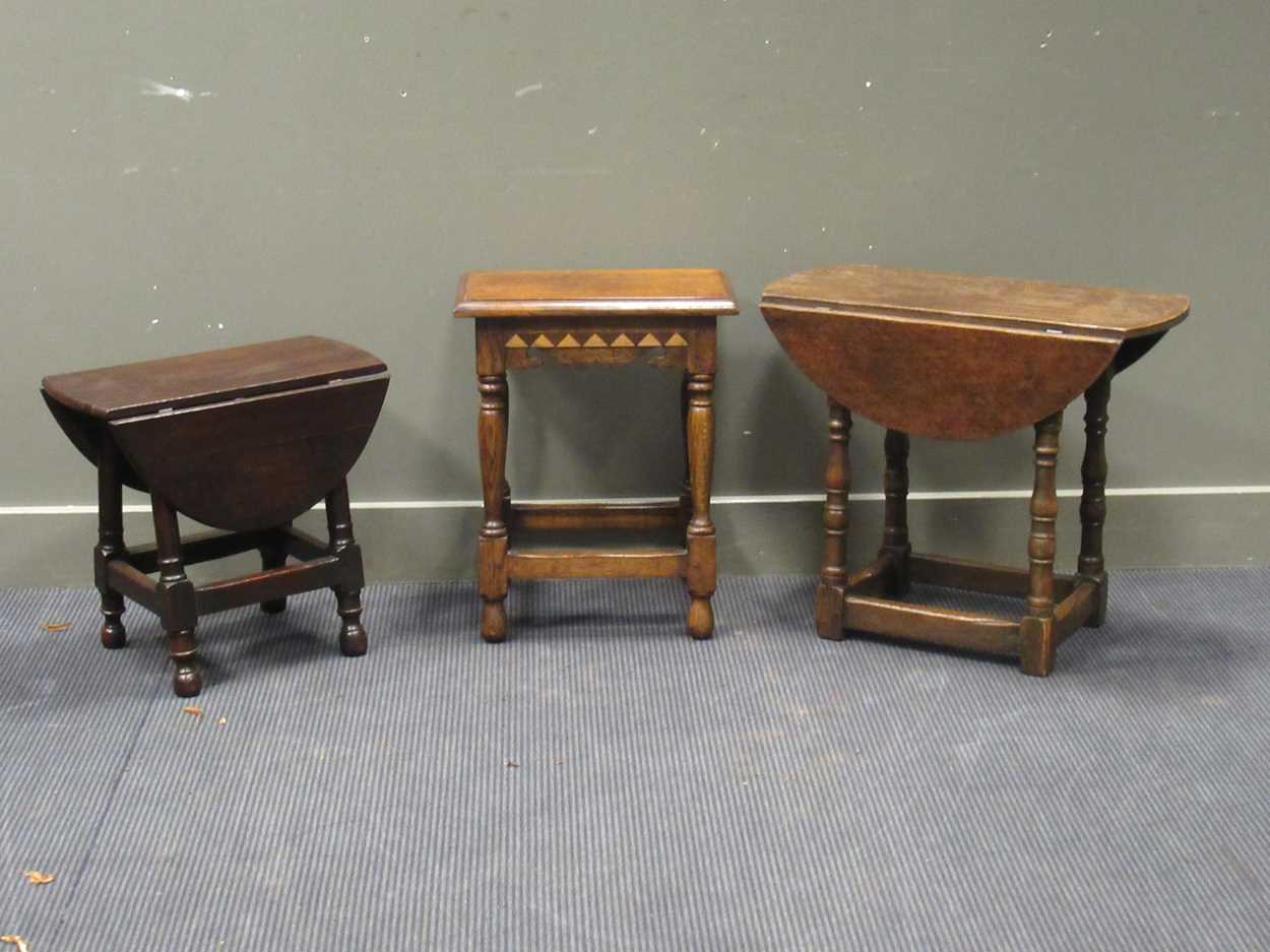 A 17th century style oak stool together with two small oak drop leaf tables (3)
