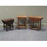 A 17th century style oak stool together with two small oak drop leaf tables (3)