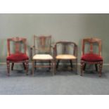 An Edwardian mahogany and inlaid armchair together with another Edwardian armchair and two late
