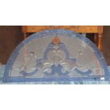An arched stained glass panel 61cm high and 118cm wide