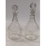 Two 19th century tripple neck ring decanters and stoppers, one engraved with swags and foliage