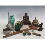 A glass walking stick, two other walking sticks, a Malay Kris, A carved handle, an enamel vase, a