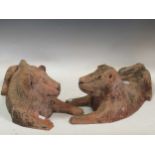 A pair of terracotta models of a lion and lioness, in archaic style, 46cm long