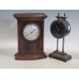 An Edwardian clock in a mahogany shaped case and a ‘gravity’, drum movement clockCondition report:
