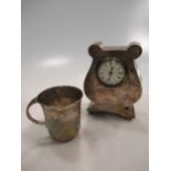 A silver lyre shaped mantle clock, 13cm high and a silver christening mug (2)