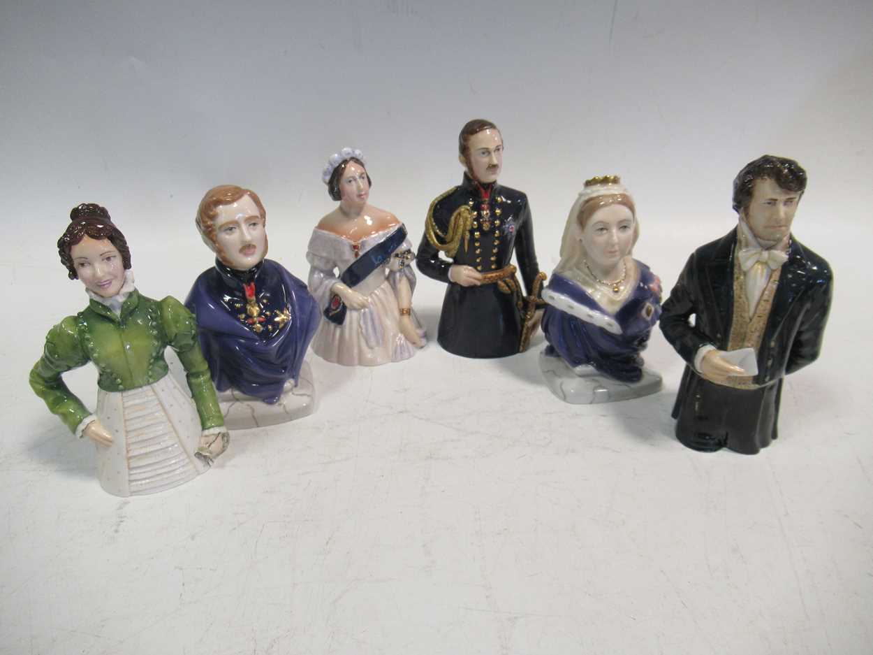 A collection of six Royal Worcester candle snuffers including both the young and the old Queen