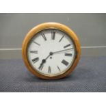 A 19th century pine circular wall clock 37cm diameter