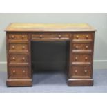 A late Victorian oak twin pedestal writing desk stamped "1209 Wilkinson & Son 8 Old Bond Street" the