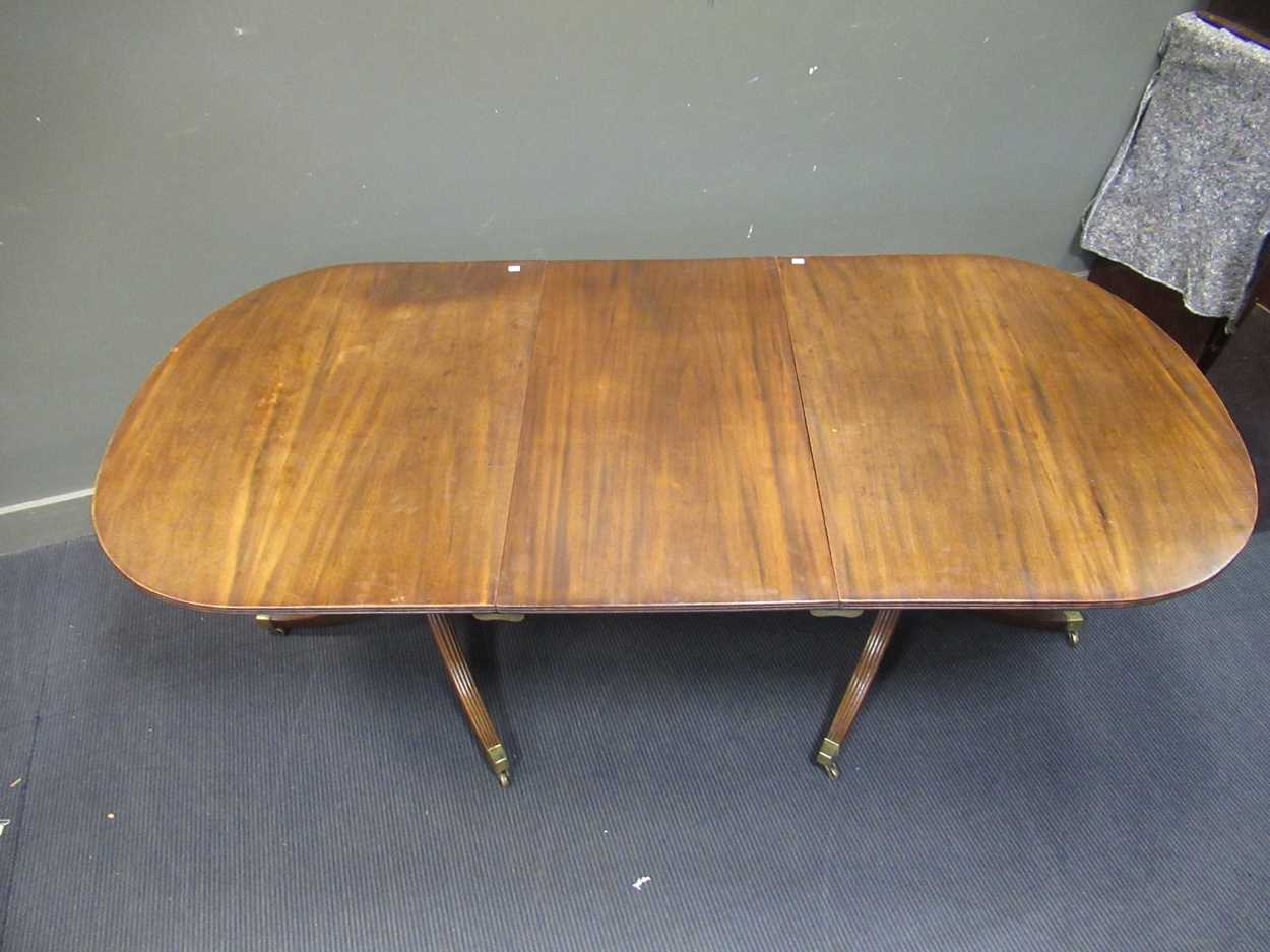 A George III style mahogany twin pedestal dining table with one leaf, early 20th century, the - Image 4 of 8