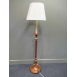 A 20th century mahogany and gilt standard lamp in the Neo classical style, 168cm high including