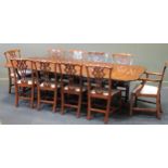 A George III style mahogany three pedistal dining table and twelve Chippendale style chairsCondition