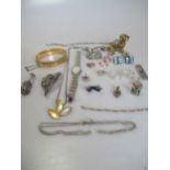 A collection of jewellery including a signet ring, a rolled gold bangle and a seiko watch