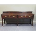 A 17th century and later West Midlands open base dresser having raised back with herbs and spices