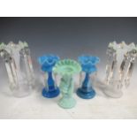 A pair of blue vaseline glass lustres, 20cm high; a white opaque pair of lustres, 27cm high; a green
